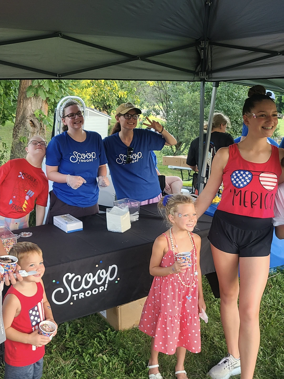 group of people at a scoop troop booth
