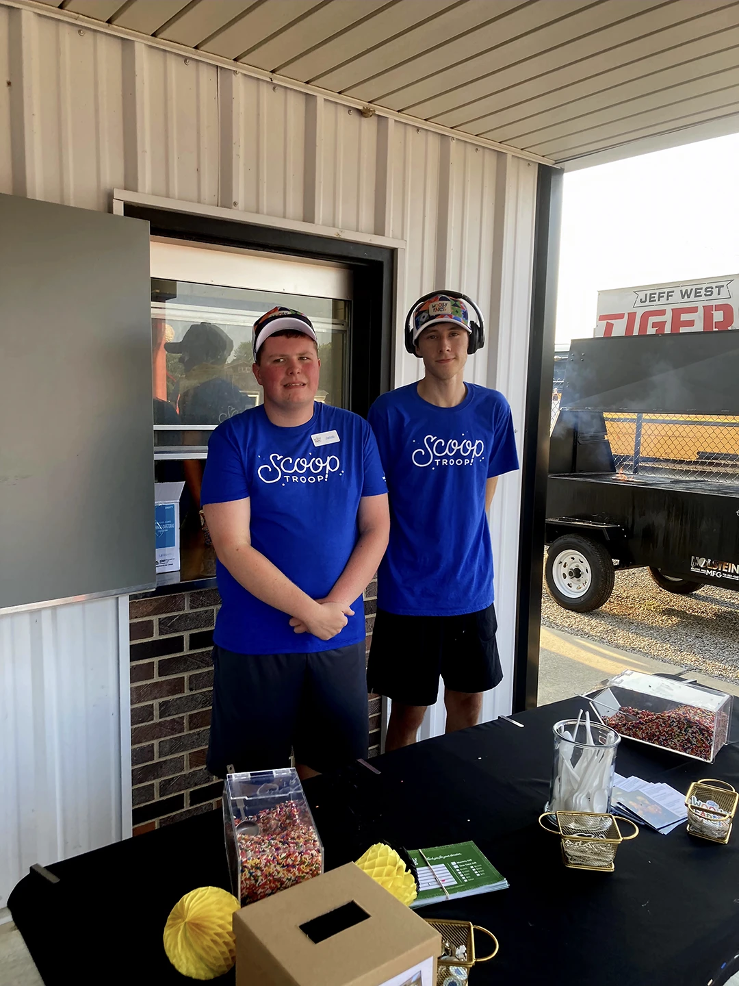 two scoop troop employees waiting for customers